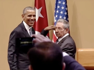 White House explains Obama's awkward handshake