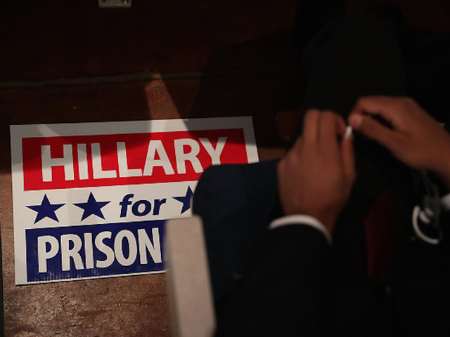 Spoof of Hillary Clinton in prison jumpsuit stirs controversy at an Iowa parade