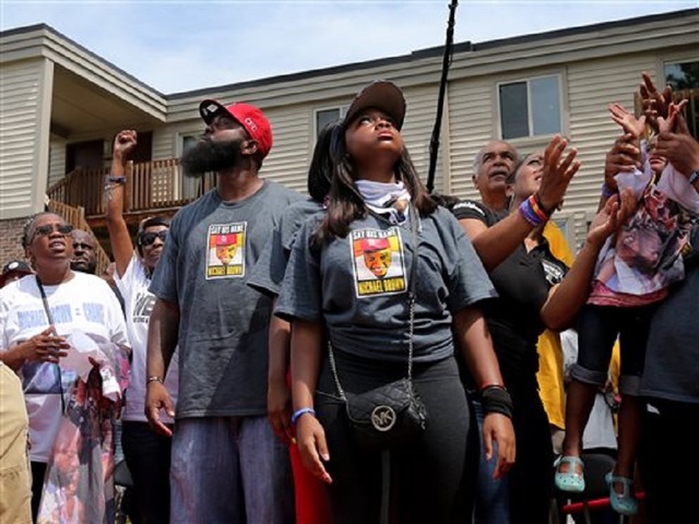 Ferguson protester hit by car, gunshots heard after, witnesses say